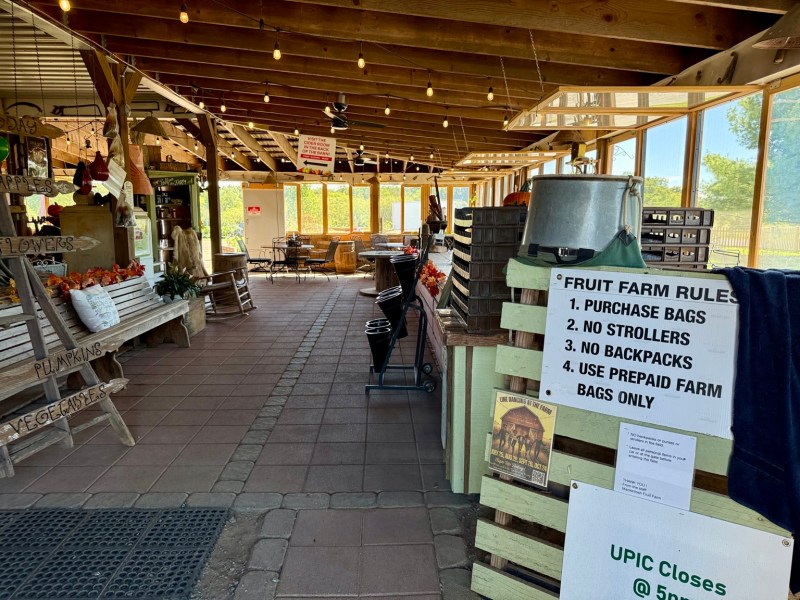 The posted U-pick rules inside the open-air farm market.